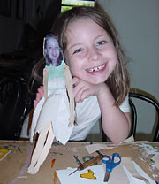 young girl with paper cut-out